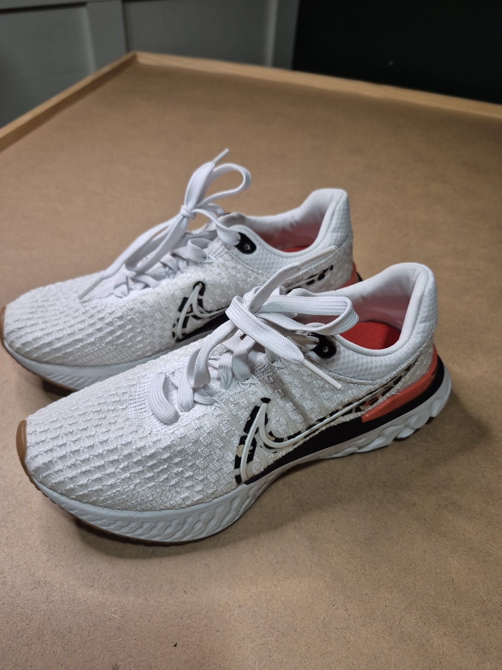 Nike Women's White Athletic Running Shoes with Coral Accents